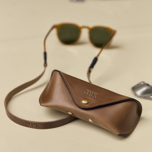 Brown leather sunglass strap with matching leather sunglasses case